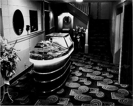 The glamorous green, white, & Black theater interior.