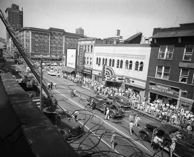 A crowd gathering to watch the extinguishing of the Roxy Theatre. The Palace Theatre was across the street from the Roxy. August 25, 1952.