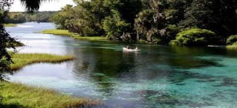 A beautiful view of the main activity area flowing into the rainbow river.