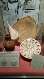 Museum Display case featuring basketry.