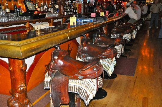 The infamous horse saddle bar stools at the Million Dollar Cowboy