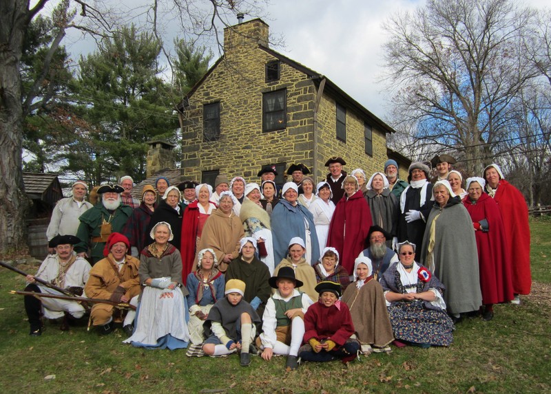 Homestead volunteers with the main house in the background.