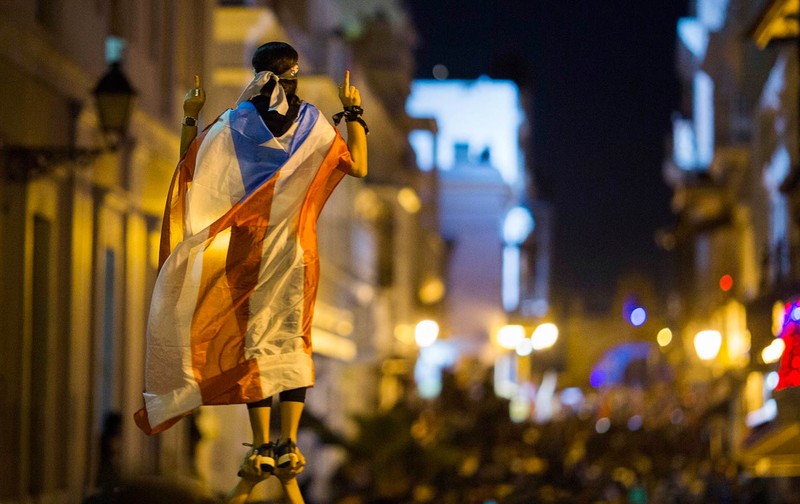 The Puerto Rican flag worn as a symbol of unity by one protester