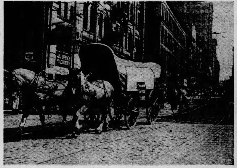 Covered wagons taking part in parade held in Pittsburgh for premiere of Unconquered.