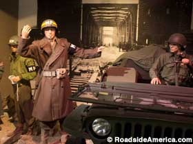 Diorama of an MP directing traffic across Remagen Bridge during WWII