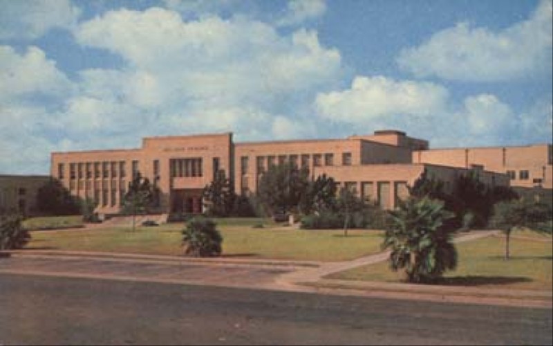 Photograph showing one of the education buildings on the campus of Del Mar College. The pictured edifice is known as the Memorial Classrooms building, and is still in use today by faculty and students more than 75 years later.