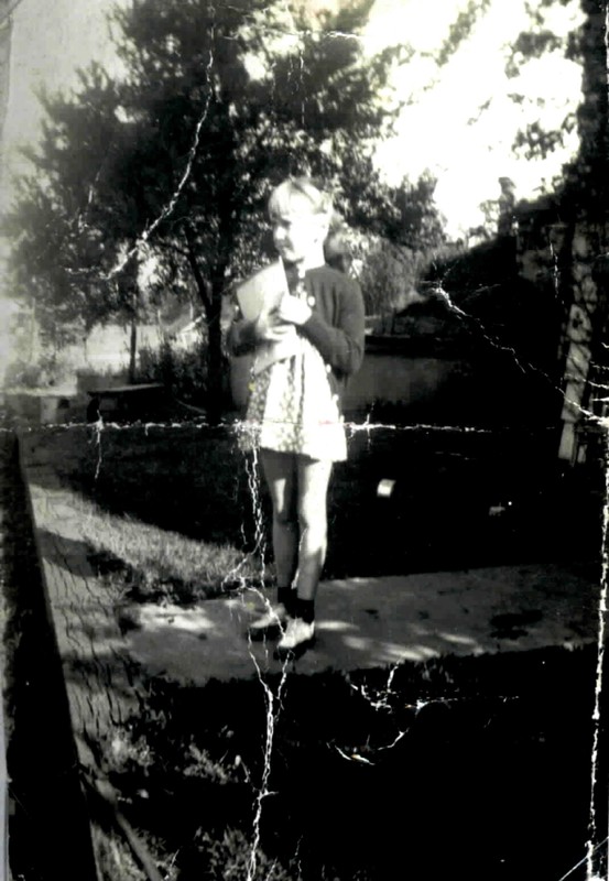 Joyce Ammons in front of E-15 well and root cellar