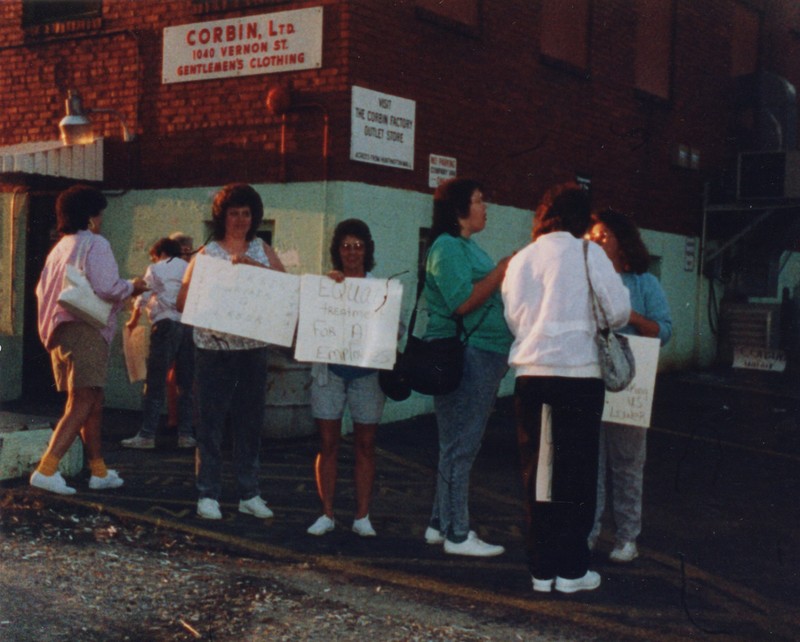 Corbin Ltd. Machine Operators Nancy Lewis and Mae Adkins, on strike in front of Vernon St. Factory, Huntington, WV, 1991