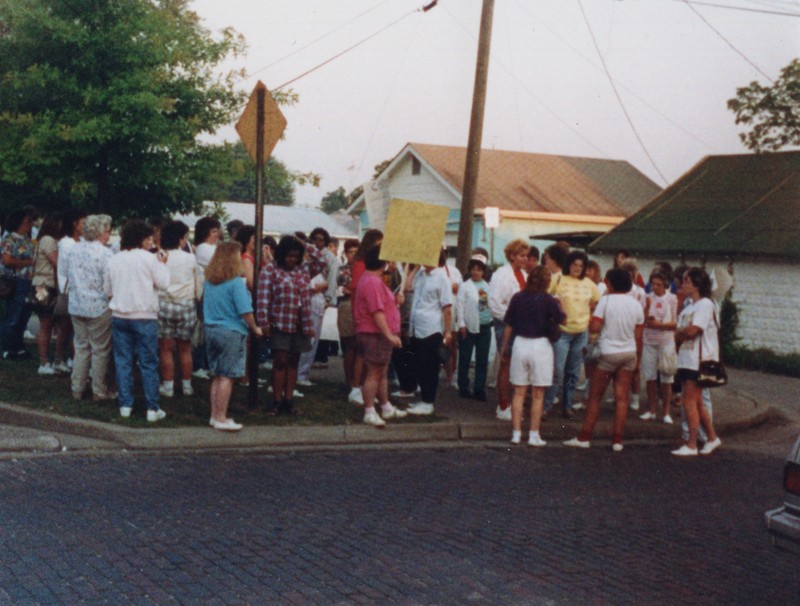 Corbin Ltd. Employees on strike protesting managers' desire that every employee work multiple sewing jobs at the Factory, in park across from Vernon St. Factory, Huntington, WV, 1991