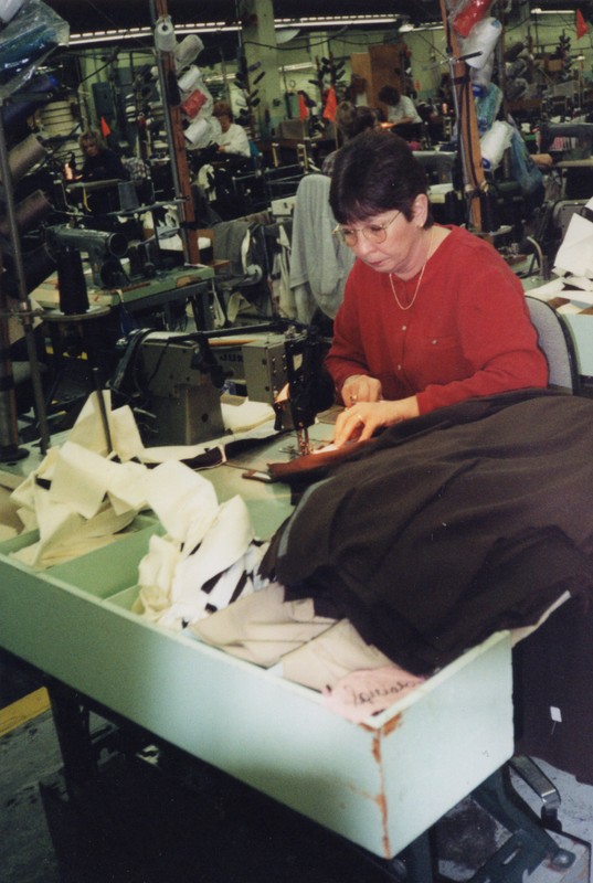 Corbin Ltd. Machine Operator Sheila Graham sewing front pockets on trousers, Huntington, WV