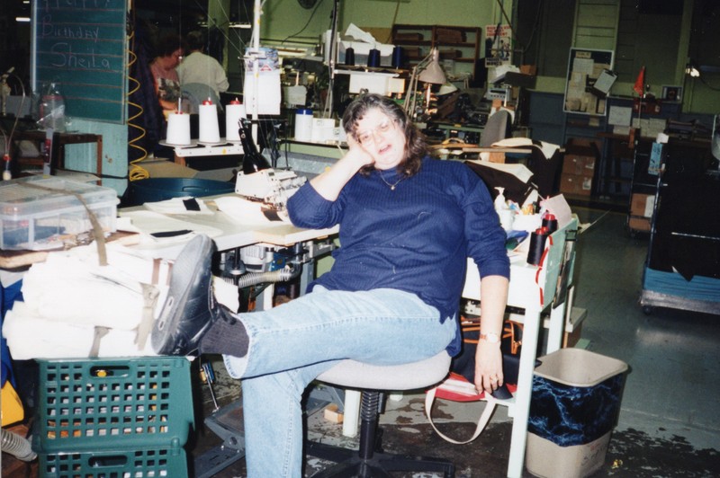 Corbin Ltd. Machine Operator Brenda Seary on break at her machine, Huntington, WV