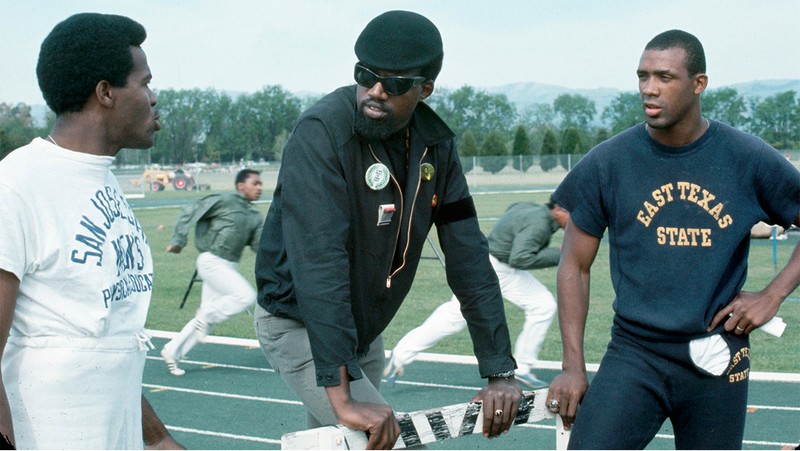 Harry Edwards, lecturer at San Jose State University, talks with Lee Evans (left) and John Carlos (right) at San Jose State University. 