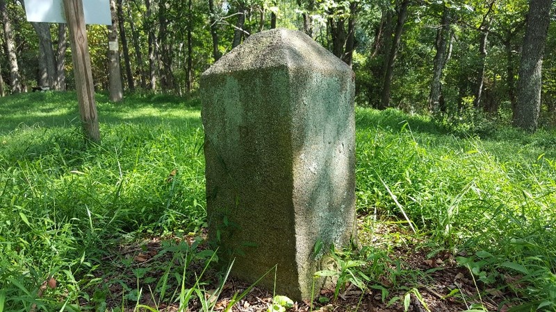 This stone marker was placed in 1883, as the original wood and earth marker had deteriorated significantly.