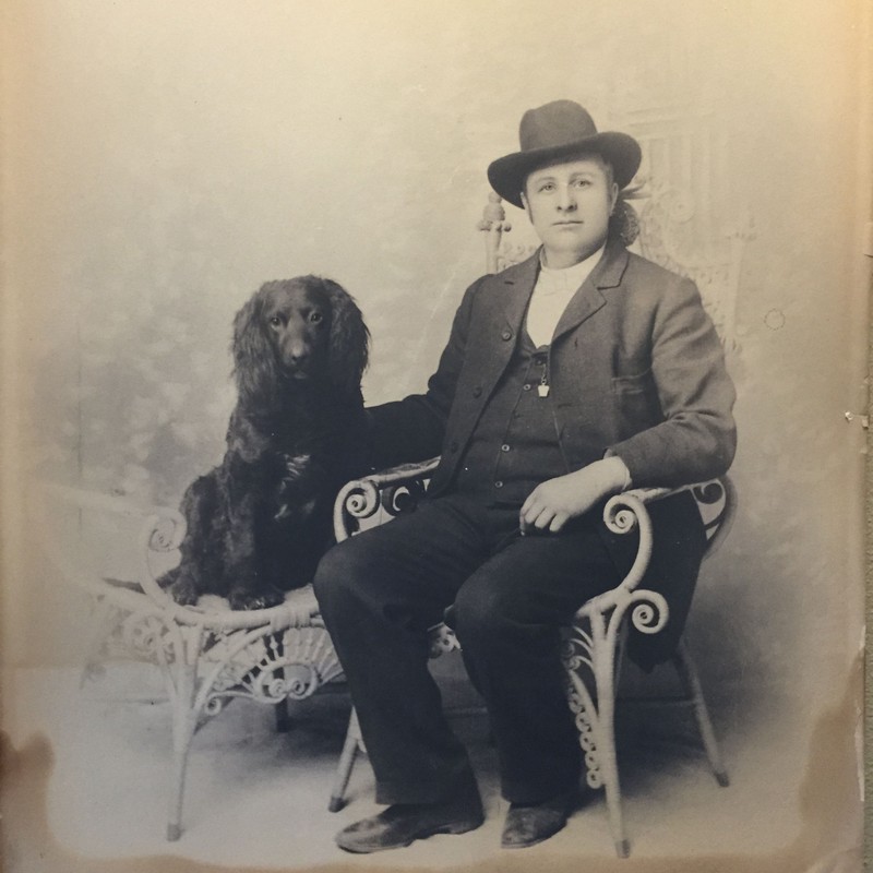 Bisbee's first librarian, Reverend J.G. Pritchard and his Cocker Spaniel. Photo courtesty of the Bisbee Mining and Historical Museum