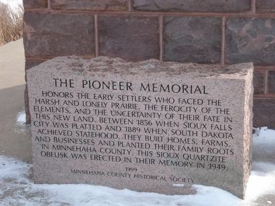 The memorial block placed at the base of the obelisk