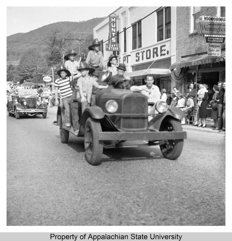 1958 Homecoming Parade, Students pass by Hunts Department Store (now Mast General Store) in downtown Boone