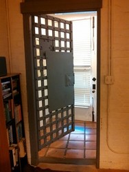 The jail's iron doors are still within and lead to eating areas, first floor and bathroom. 