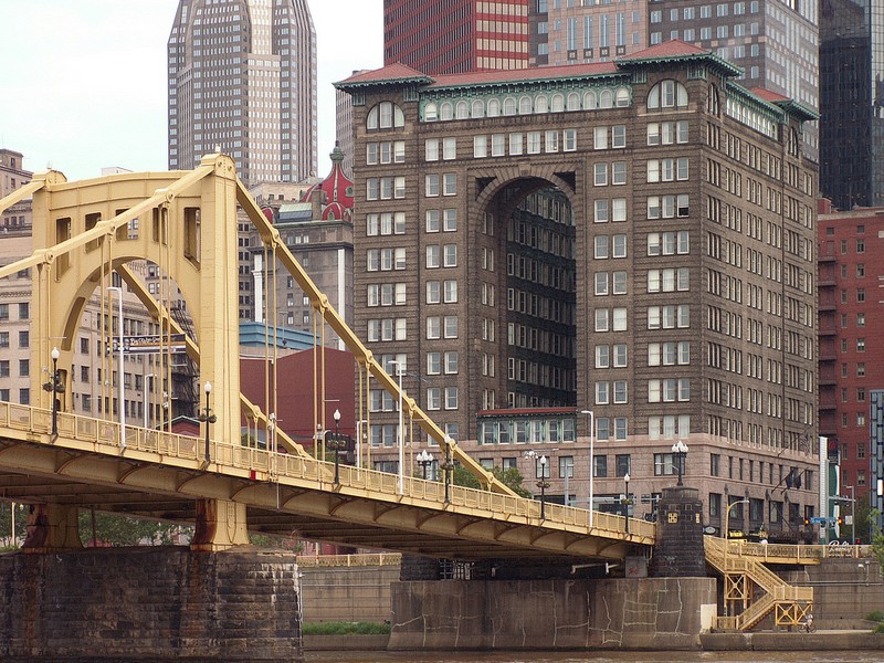 The Fulton Building with the Roberto Clemente Bridge in the foreground.