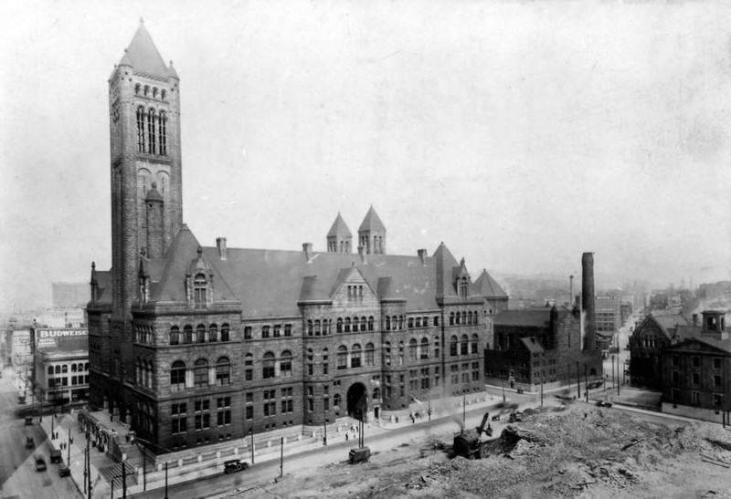 The courthouse and jail prior to being enclosed by modern skyscrapers.