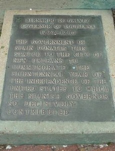 The sign at the base of the statue