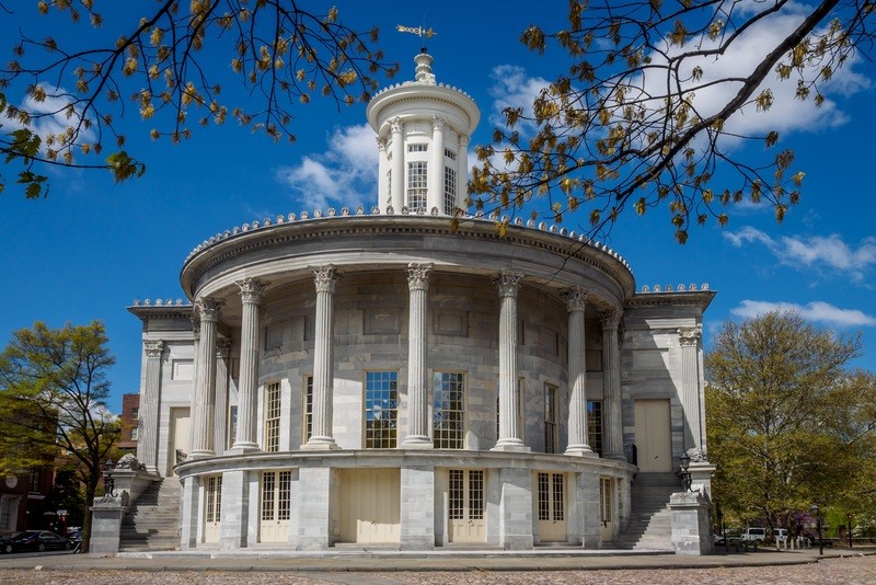 The Exchange Building's famous semicircular design and Greek Revival columns.