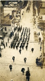 The Armory was completed and dedicated in 1917. This photograph shows troops marching along Court Street at the dedication ceremony. 