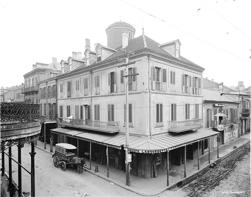 A horse-drawn ice wagon makes a delivery to Labourdette's Grocery (aka Napoleon House) c. 1905.  