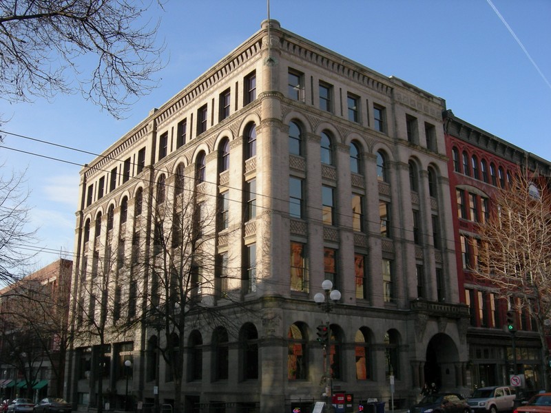 This five-story masonry building was designed by Albert Wickersham and features many elements of the Romanesque Revival style of architecture.