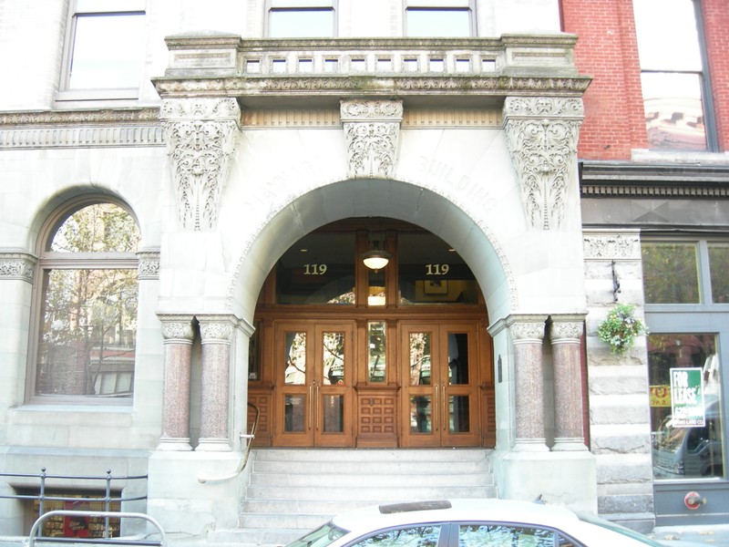 The building's main entrance features an arch that bears the name of "Doc" Maynard. The building was renamed in honor of Maynard in the 1920s. 