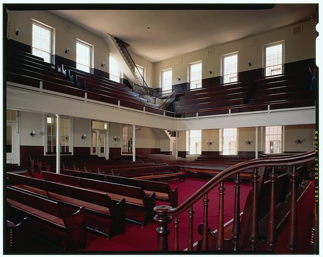 The clean interior of the meetinghouse house to include the balcony or "youth galleries" that line three side of the spacious room.