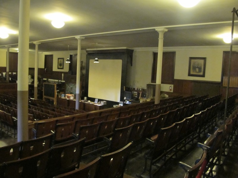 The institute's lecture hall is still used today as is its antique glass lantern which is used to display the library's slide collection.  