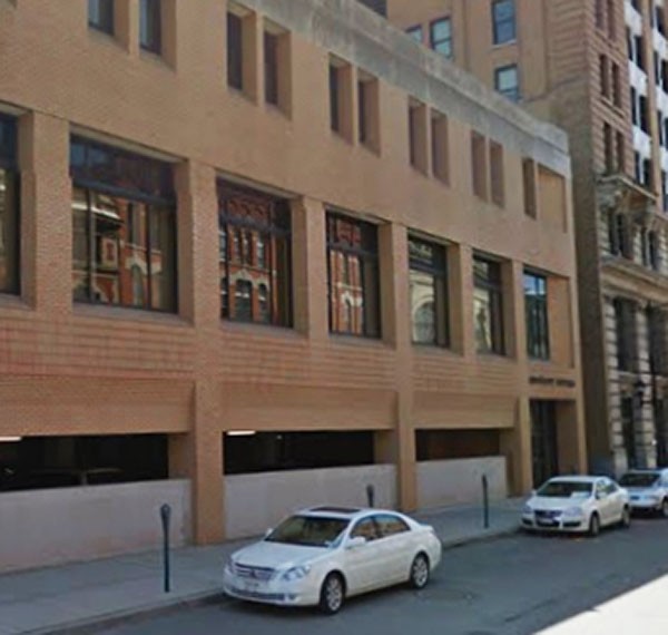 This parking ramp is site of the Broome County Women's Suffrage Party headquarters, 1916-1917. Formerly Jos. Feinbloom Milinery, building later demolished.