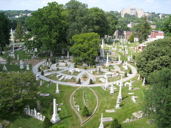 An aerial view of a small section of the cemetery in which the many obelisks stand like spires, memorializing the dead.  