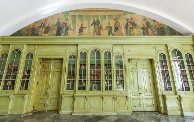 One of the large interior rooms of Founder's with a mural of Girard painted above the doors.  