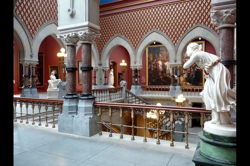 The academy's ornate central staircase that leads up to exhibit space on the second floor.  As one ascends, it's difficult to keep ones' eyes off the works of art and on the stairs.  