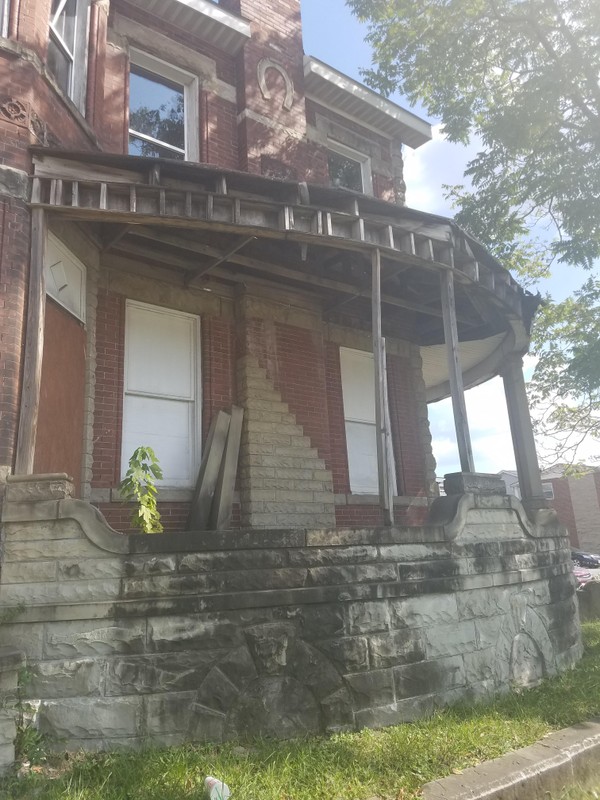 The roof covering this romantic rounded veranda is falling in yet the sandstone foundation remains strong.