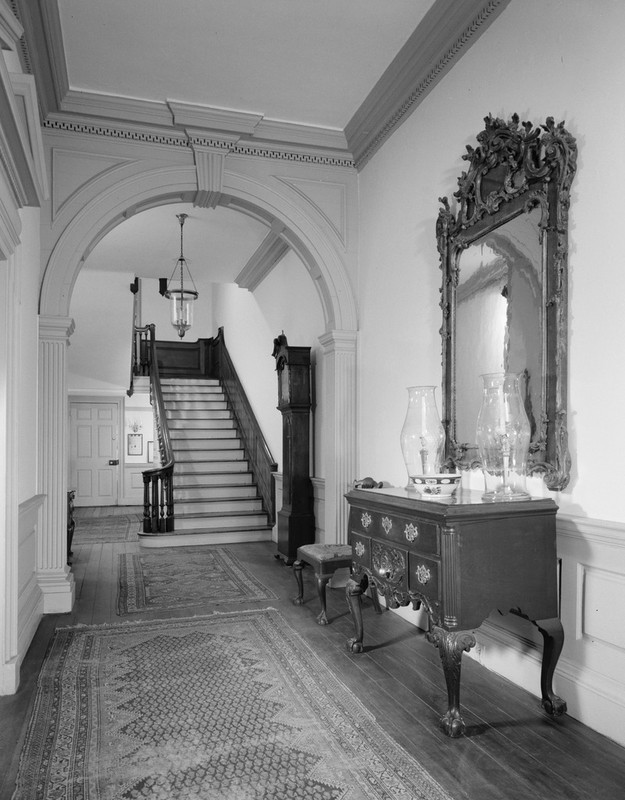 The Powel House's restored front entryway and mahogany staircase.  