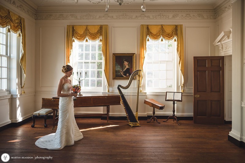 A bride contemplates her upcoming nuptials in the Powel House's front parlor.