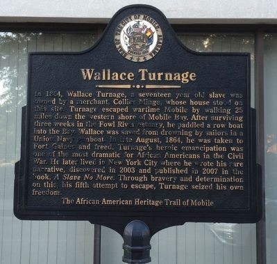 The marker is located on the sidewalk next to the Saenger Theatre Mobile.