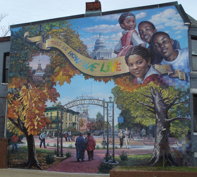 "This is How We Live," a mural from The Park at LeDroit by Garin Baker. CC BY-SA 3.0, https://en.wikipedia.org/w/index.php?curid=20967083