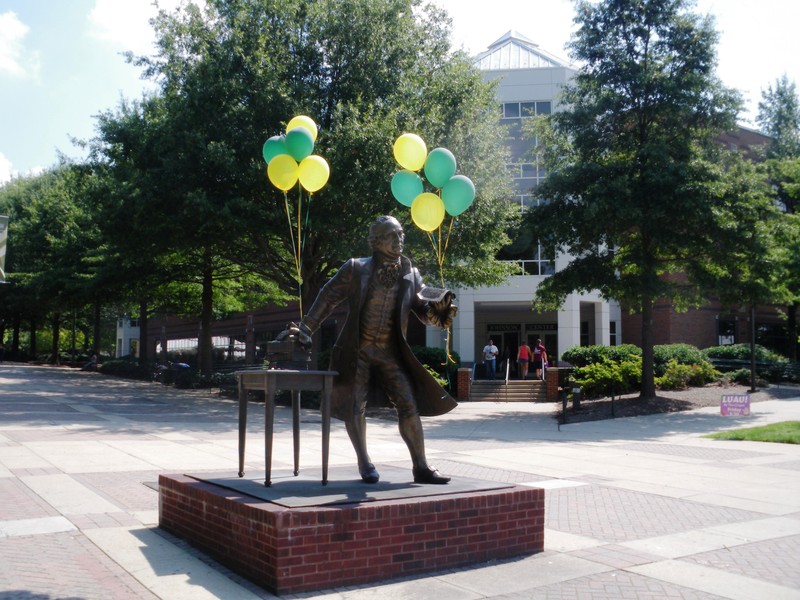 Statue of George Mason in front of the Johnson Center; image by Lucien Dalarun - Own work, CC BY-SA 3.0, https://commons.wikimedia.org/w/index.php?curid=22717714