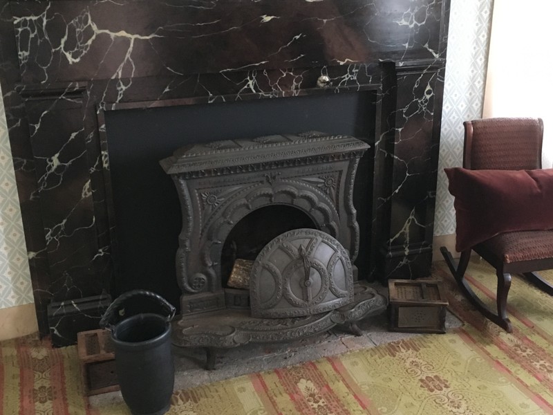 Fireplace with footwarmers and fire bucket