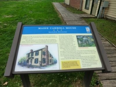 Several interpretive historical markers surround the house, detailing its history and that of the Battle of Guyandotte. 