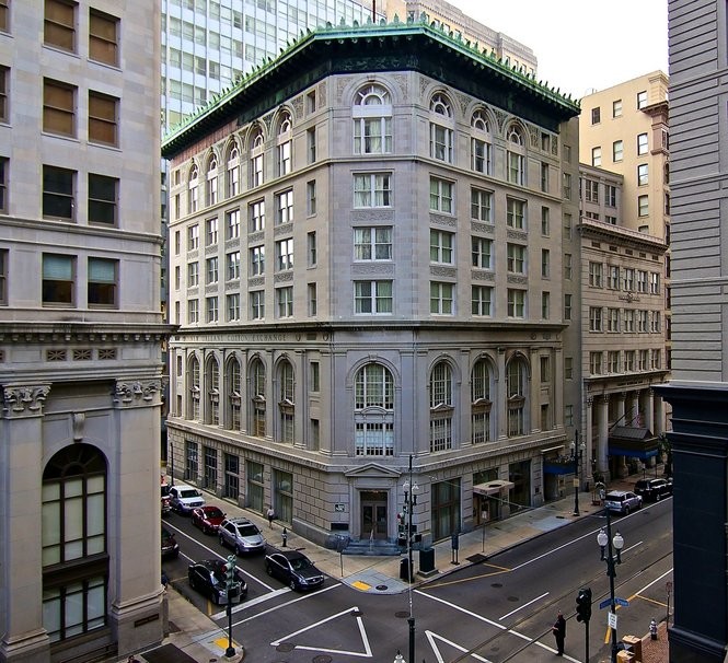 The New Orleans Cotton Exchange existed at this intersection from 1871-1964. The last building that was its home is now a hotel.