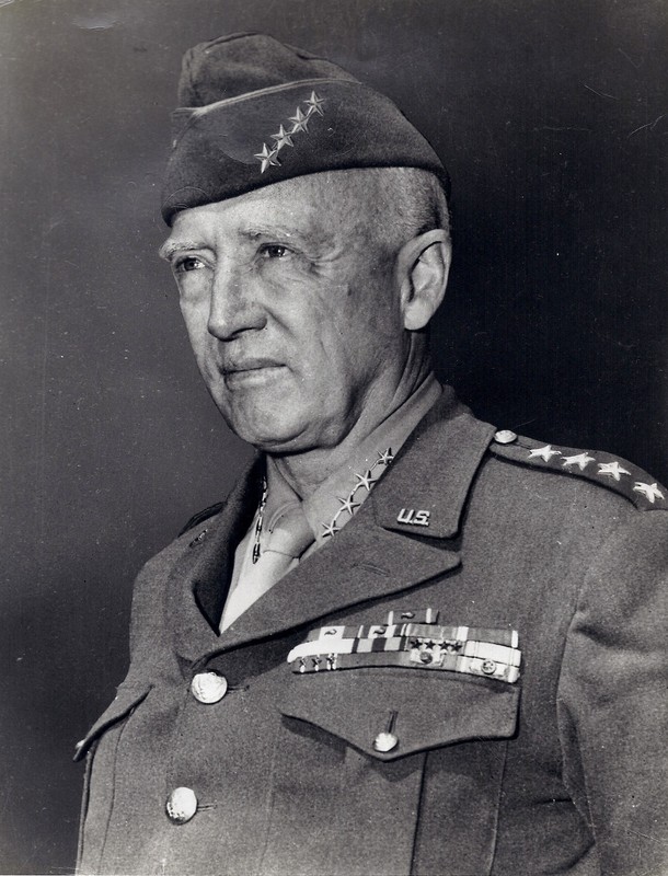 Photograph of General George Smith Patton, Junior in full military uniform and vice-cap bearing his four stars