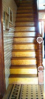 This narrow staircase leads to the home's second floor.  Guests would use the double-staircase on the home's exterior to access the second floor.  