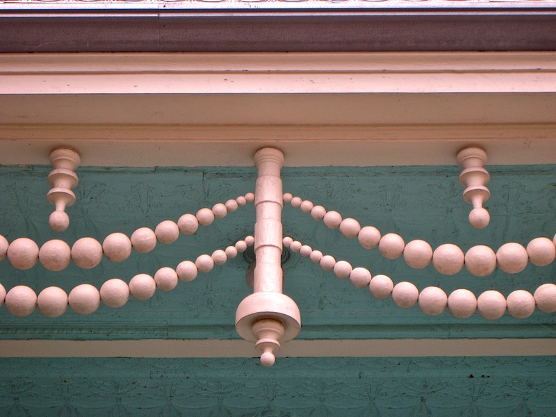 Yet another unique feature to the homes are these large carved cypress balls that resemble strings of pearls draped along the second floor porches.  