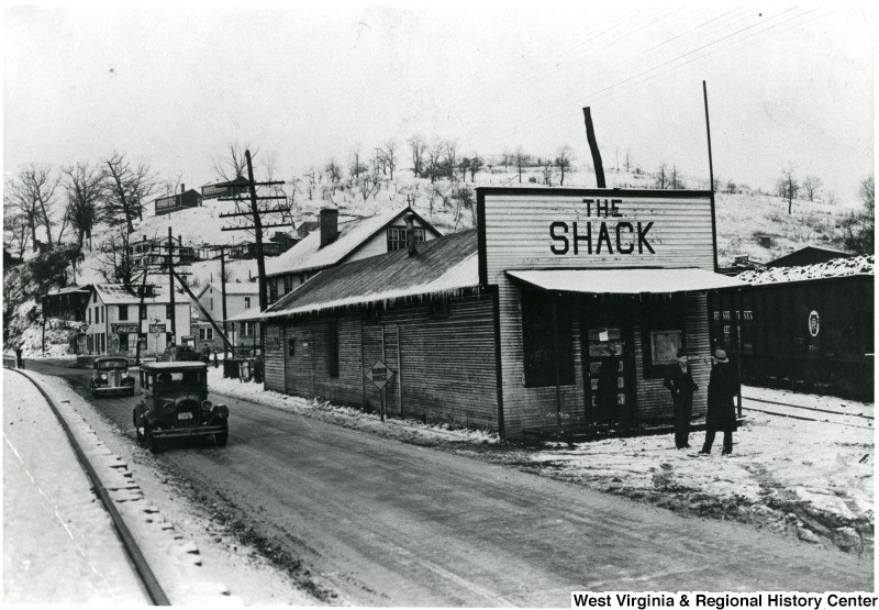 Two men in front of The Shack