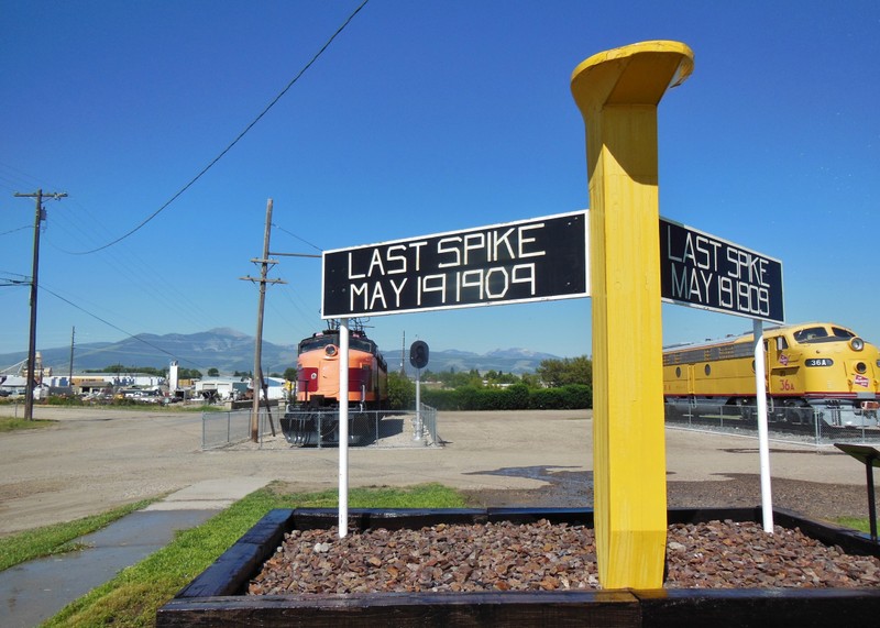 The Last Spike Monument features a large yellow spike and interpretive panels. Milwaukee Road rolling stock are located here as well..