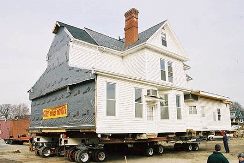 The Alexander Black House as it was being moved to its current location on Draper Road. Its conversion to a funeral home left the exterior signifigantly different from its original appearance. Photo obtained from Blacksburg.gov.